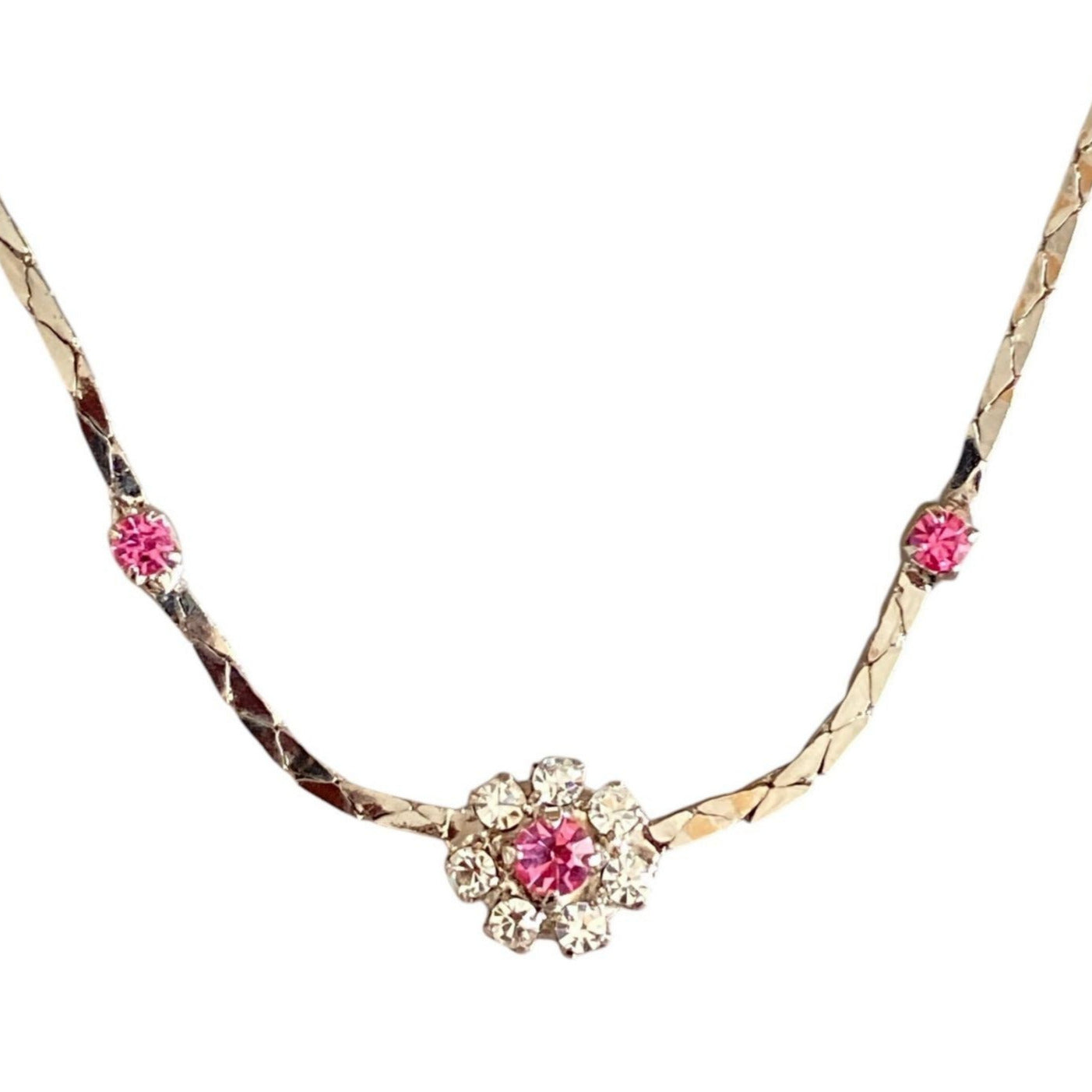 Elegant halskjede med rosa og klare stener