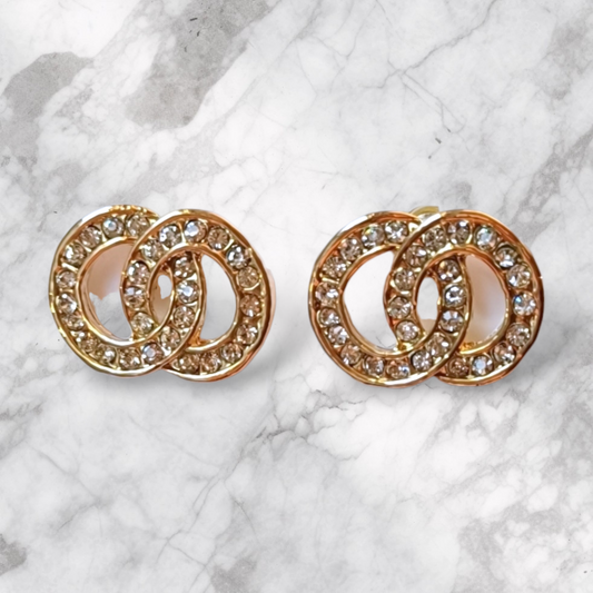 Gullfargede øredobber med doble sirkler og klare krystaller